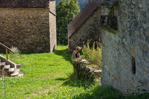 Summer in the stables of Orias in Carnia. Ancient constructions photo