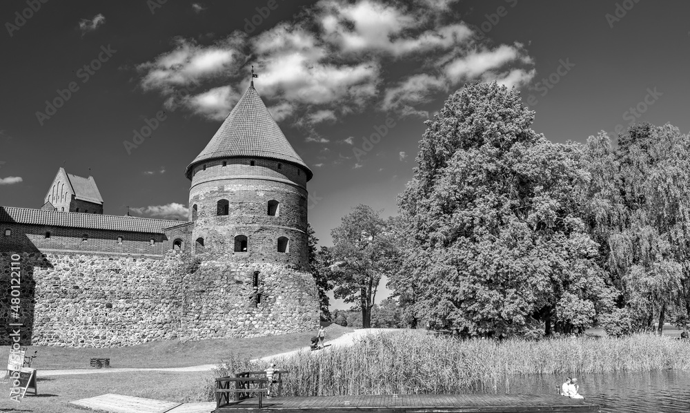 TRAKAI, LITHUANIA - JULY 10, 2017: Tourists visit Trakai Castle on beautiful sunny day.