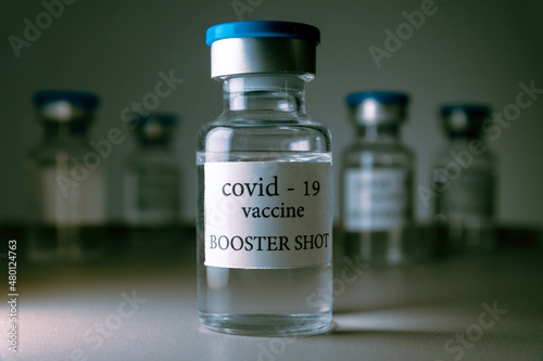 COVID-19 booster vaccine vials. Medicine and health care concept