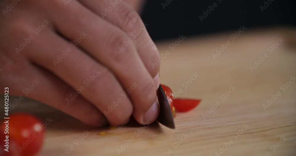 Close Up Cutting Cherry Tomato on Wooden Board Close Up Cutting Cherry Tomato on Wooden Board