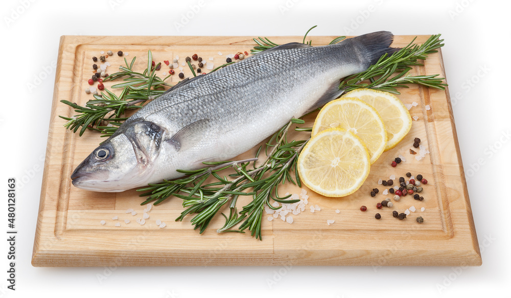 Fresh uncooked sea bass with lemon and rosemary on wooden board over white backdground with clipping path Fresh uncooked sea bass with lemon and rosemary on wooden board over white backdground with clipping path
