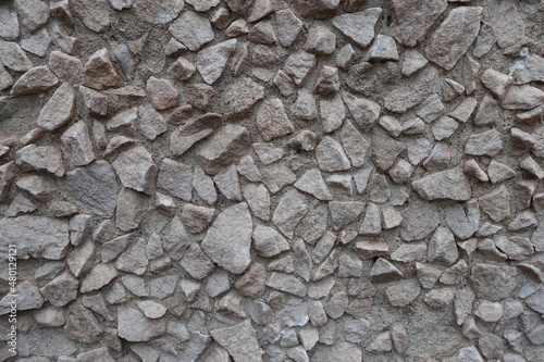 light gray gravel pebble dash on the wall (front view)