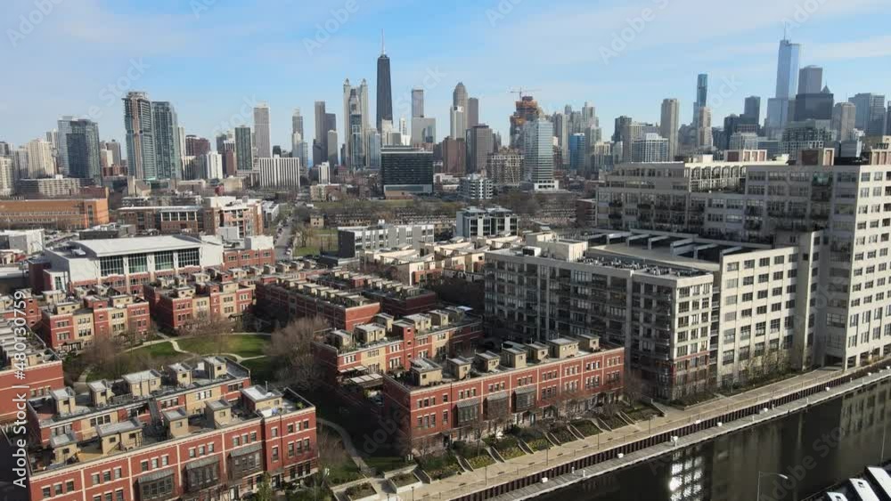 Aerial view in the city of Chicago with many buildings and rivers in view and lots of metro activity Aerial view in the city of Chicago with many buildings and rivers in view and lots of metro activity