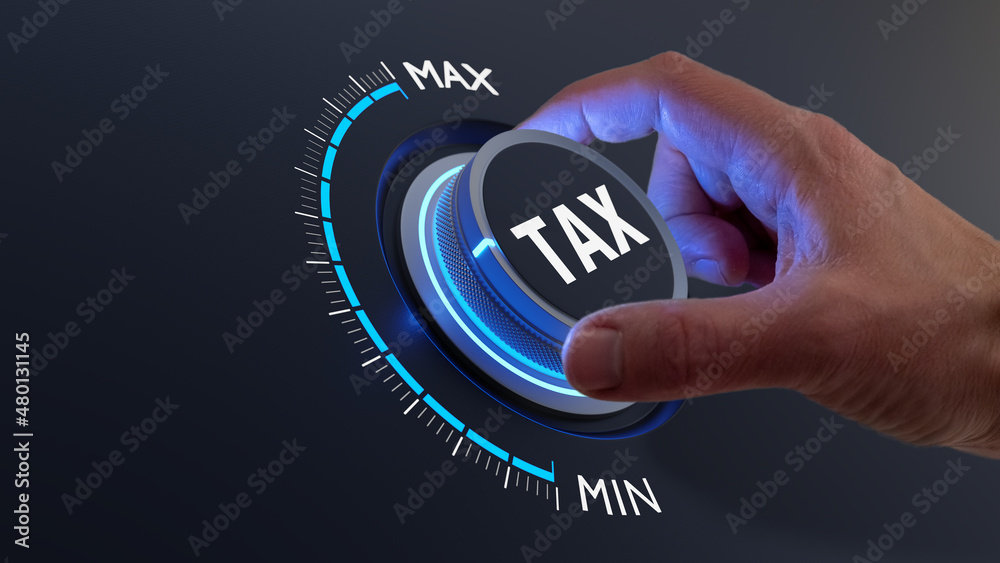 Tax reduction and deduction for businesses and individuals. Concept with hand turning knob to low taxation rate. Return form, exemptions, incentives. - obrazy, fototapety, plakaty 