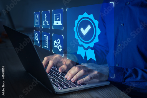 Certification and standardization process, quality assurance and conformity to international standards. Concept with icons for certificate, approval, compliance to requirements. Person using computer