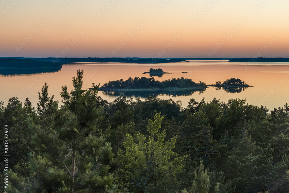 Early, summer dawn, over the sea. Nature of Scandinavia. Islands in the sea. Finland.