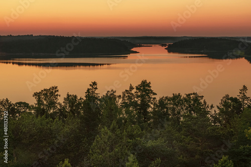 Early, summer dawn, over the sea. Nature of Scandinavia. Islands in the sea. Finland.