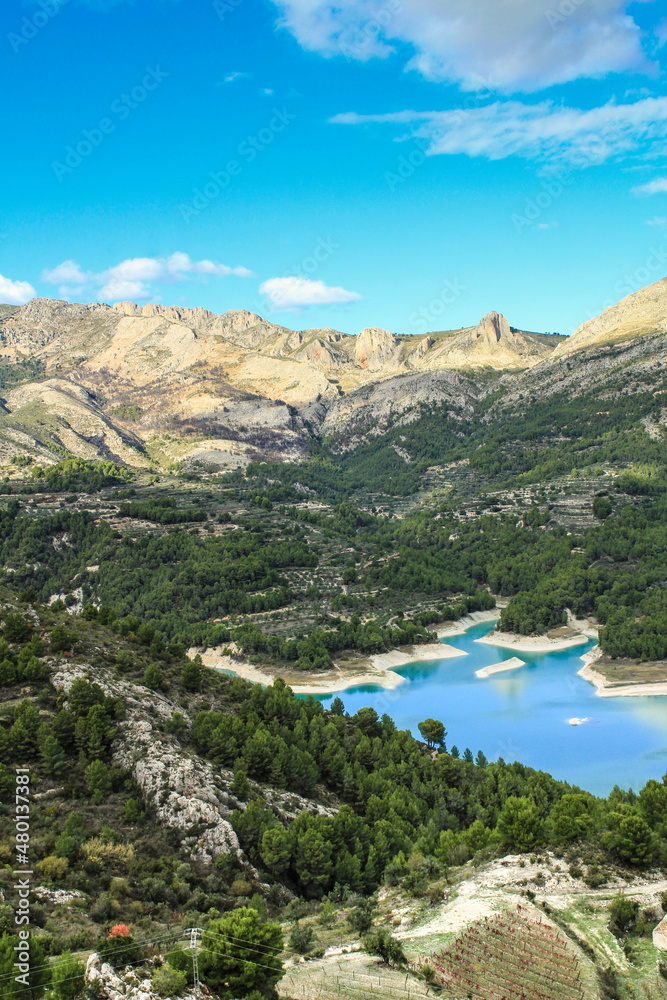 The swamp of Guadalest village surrounded by vegetation and mountains The swamp of Guadalest village surrounded by vegetation and mountains