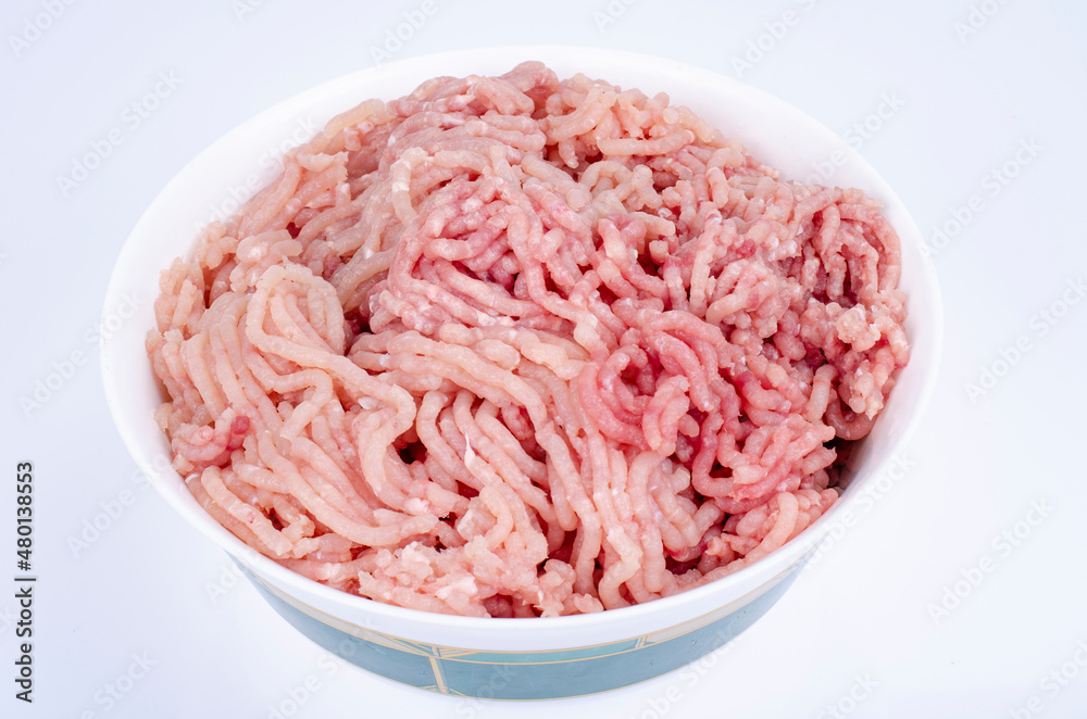 Minced fresh chicken meat on white background. Studio Photo Minced fresh chicken meat on white background. Studio Photo