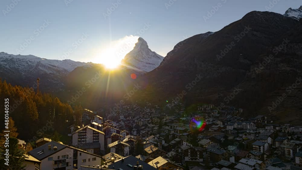 Timelapse as the sun sets over Zermatt and the Matterhorn in Switzerland.