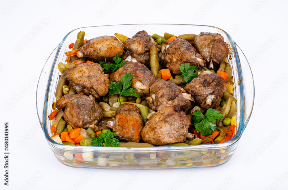 Glass dish with baked vegetables and chicken pieces. Studio Photo Glass dish with baked vegetables and chicken pieces. Studio Photo