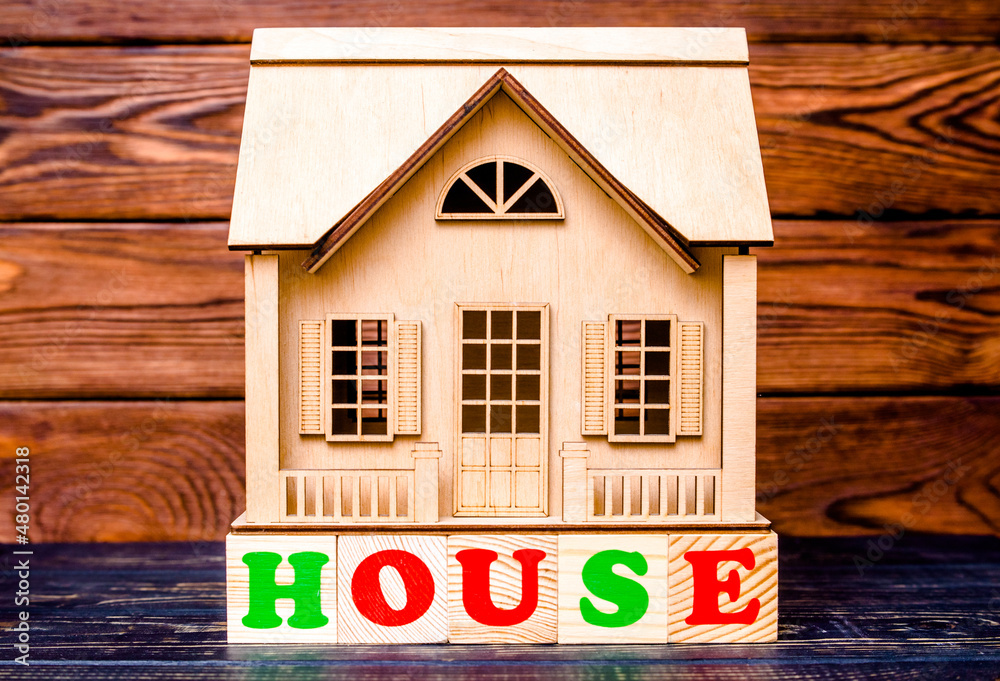 Wooden home and text on the cubes HOUSE
Wooden home and text on the cubes HOUSE