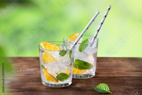 Refreshing mojito on a wooden table in nature