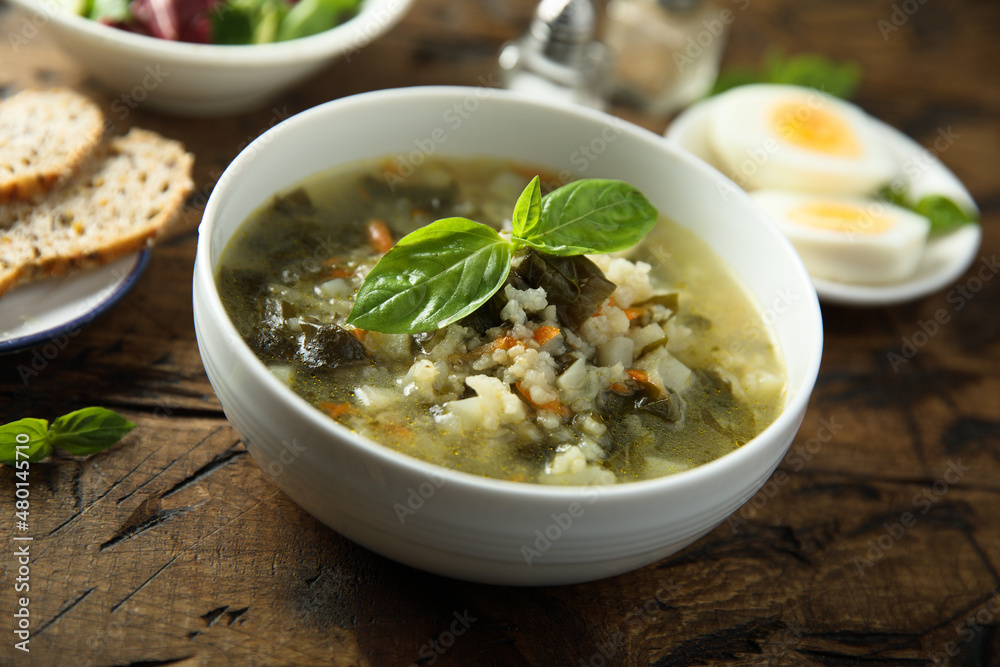 Traditional homemade green soup with hard boiled eggs Traditional homemade green soup with hard boiled eggs