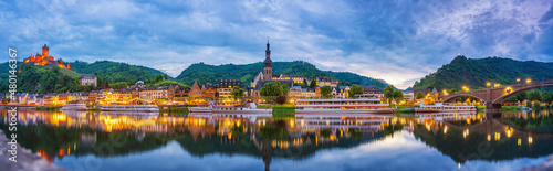 Cochem, Rhineland-Palatinate, Germany - 03.06.2021. Panorama of the city of Cochem with Reichsburg Castle and the Moselle river in the evening. Night shot.