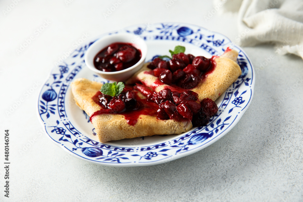 Homemade crepes with hot cherry sauce Homemade crepes with hot cherry sauce
