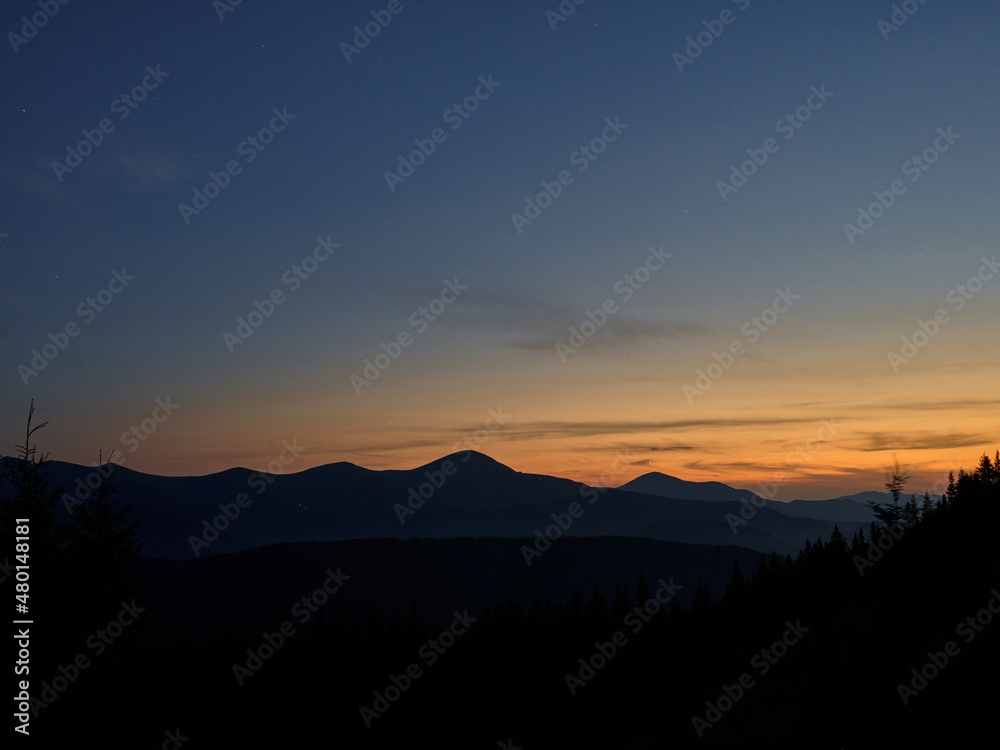 summer sunset at charphatian mountains with view on Chornogora