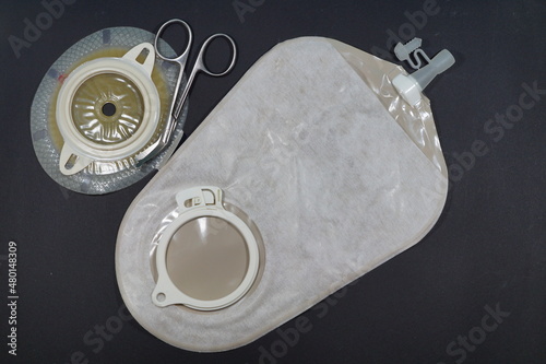 Urostomy and  nephrostomy bag - Ostomy medical care equipmen: Two-piece urostomy bag with the valve adhered to the skin of the patient. Ostomy plate for fixing urostomy bag