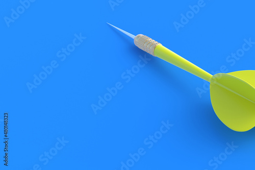 Toys for adults and children. Game for leisure. International tournament, competitions. Yellow dart on a blue background. Copy space. 3D rendering