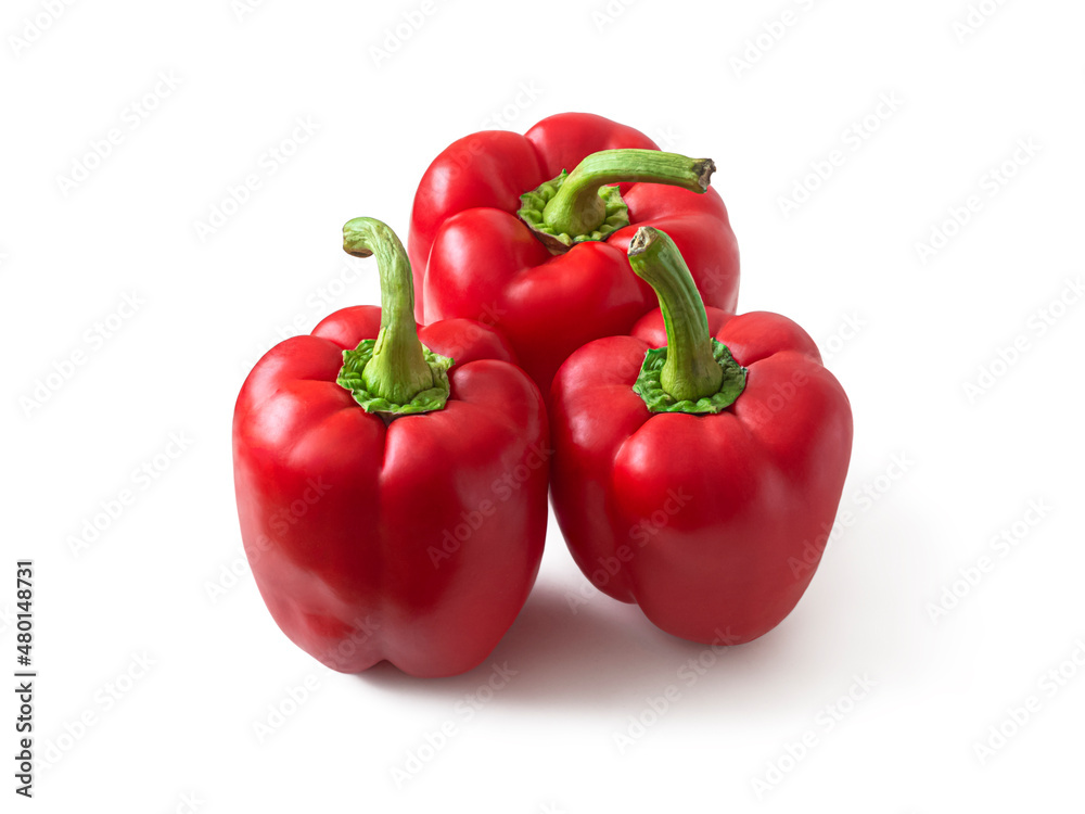 Ripe red bell peppers on a white background Ripe red bell peppers on a white background