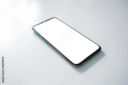 Smartphone with copy space on the table. Cellphone display mock up. Top view