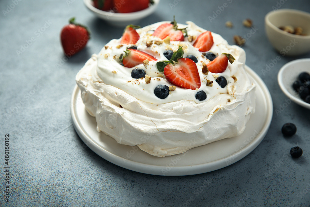 Pavlova meringue dessert with fresh berries