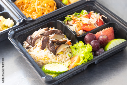 Thai Vegan food, lunch boxes, Shitake mushroom fried rice and spicy mush room salad.