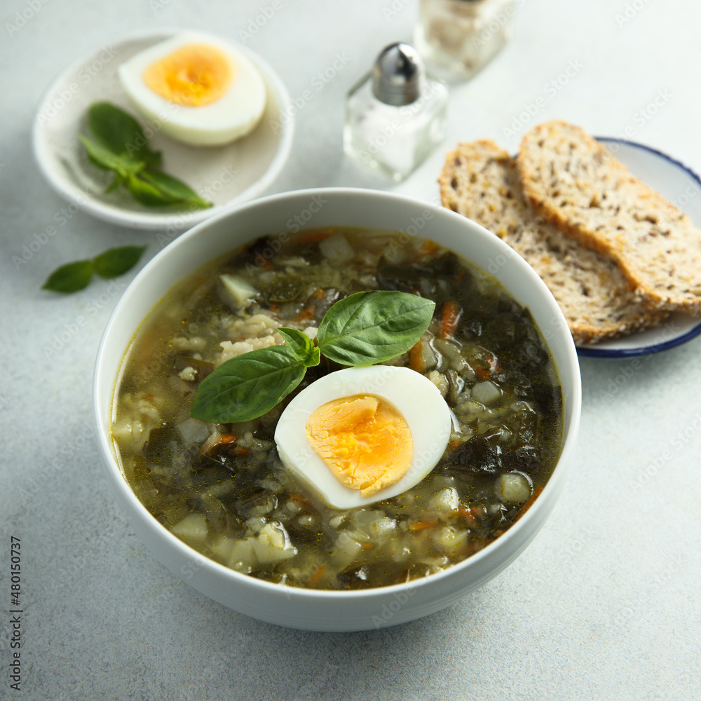 Traditional homemade green soup with hard boiled eggs Traditional homemade green soup with hard boiled eggs