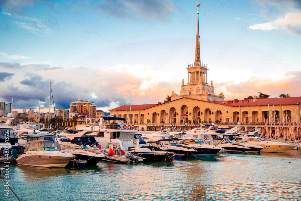January 02, 2022, Sochi, Russia, Marine Station, beautiful yachts and boats against the backdrop of the port building