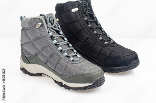 Winter waterproof insulated sports shoes on white background. Studio Photo