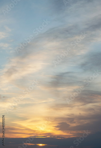 Blurred image of the sunset in the sky with clouds.