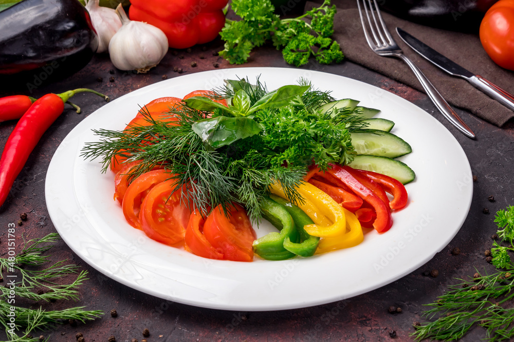 slicing fresh vegetables on a plate on dark table slicing fresh vegetables on a plate on dark table