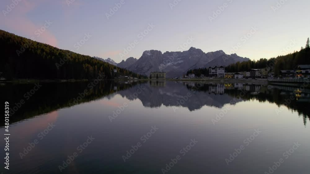 Aerial View of Emerald lake and boathouse in Lake Braies, Dolomites, Italy. Aerial View of Emerald lake and boathouse in Lake Braies, Dolomites, Italy.