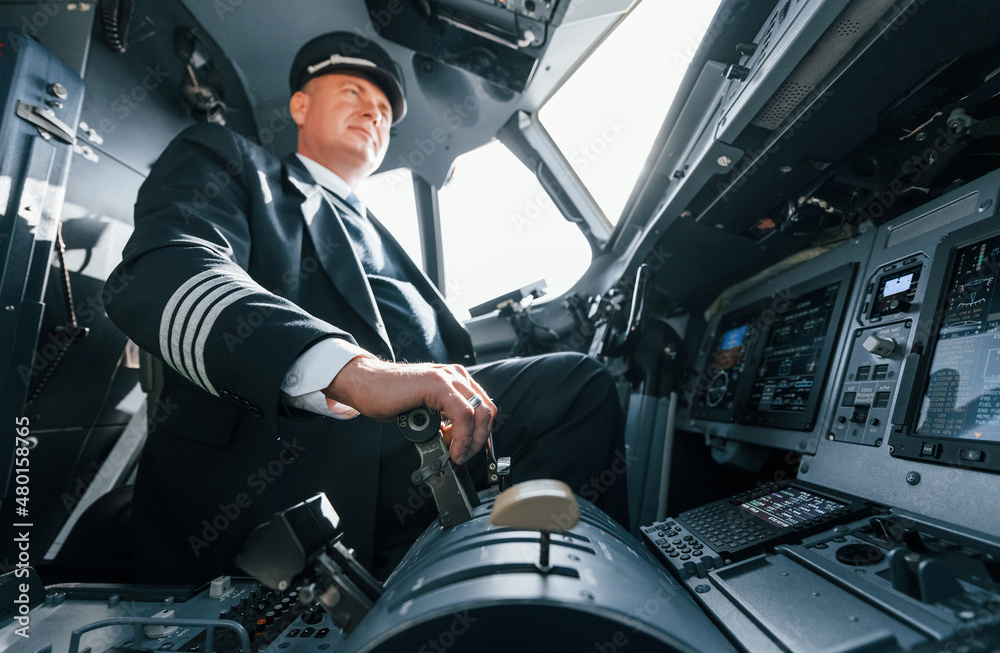Naklejka premium A professional pilot is in the cockpit. Conception of work