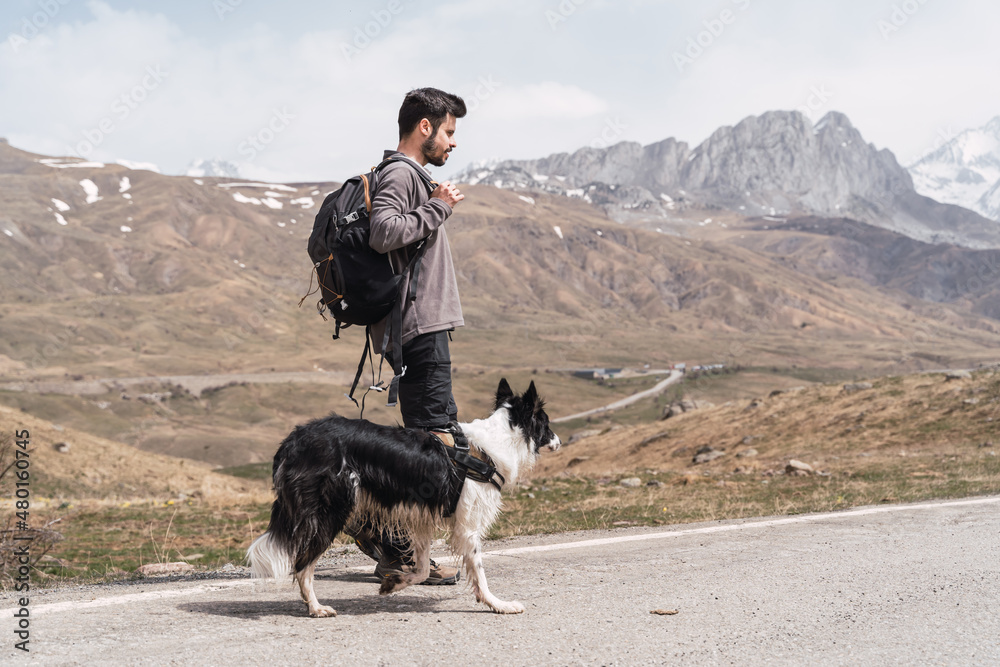 Man and his dog in the mountain