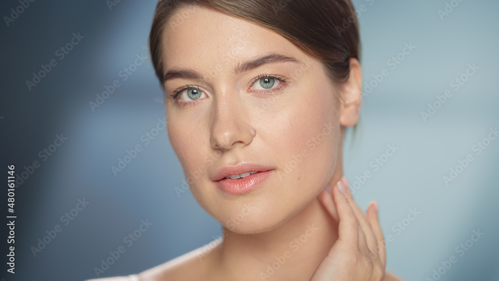 Female Beauty Portrait. Beautiful Caucasian Woman with Brown Hair and Light Green Eyes Posing, Touching Her Natural, Clean Skin. Wellness and Skincare Concept on Soft Isolated Background. Close Up. Female Beauty Portrait. Beautiful Caucasian Woman with Brown Hair and Light Green Eyes Posing, Touching Her Natural, Clean Skin. Wellness and Skincare Concept on Soft Isolated Background. Close Up.