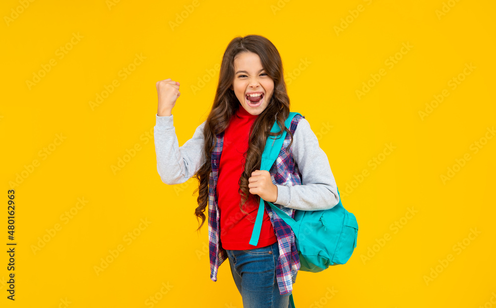 successful kid has long curly hair carry school backpack on yellow background, knowledge successful kid has long curly hair carry school backpack on yellow background, knowledge