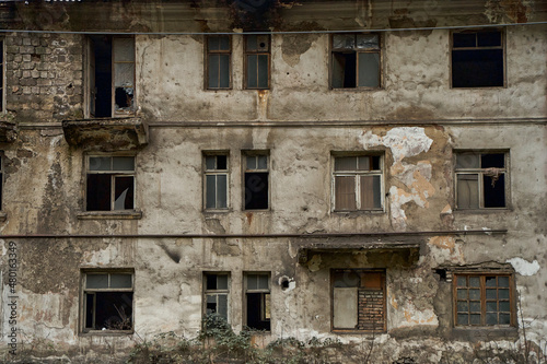 Abandoned crumbling buildings in a residential city. A dying city. Frightening atmosphere
