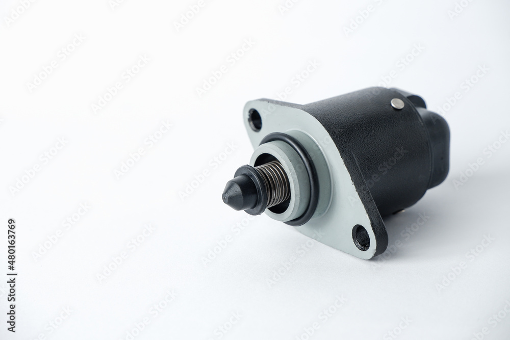 Auto parts . Car injector engine idler . close up on white background. idle air control valve Auto parts . Car injector engine idler . close up on white background. idle air control valve