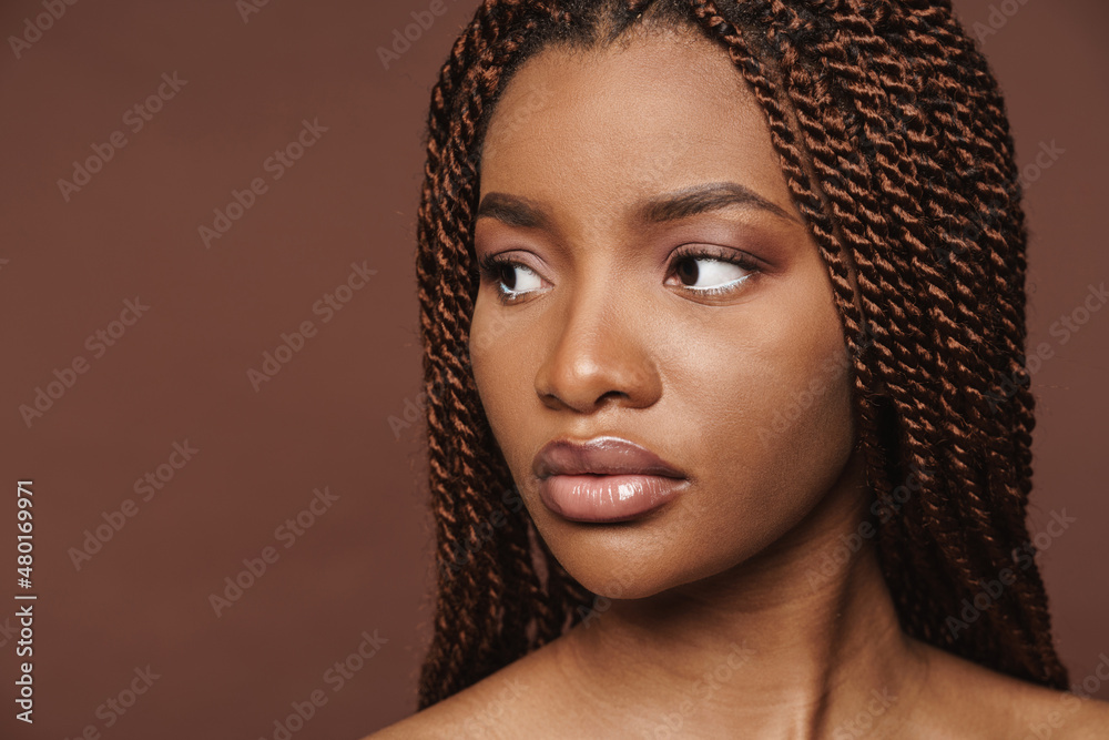 Half-naked black woman posing and looking aside Half-naked black woman posing and looking aside