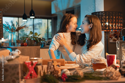 Happy beautiful family, mother and son preparing for Christmas together at home