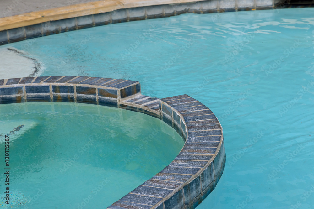 Empty swimming pool with blue water