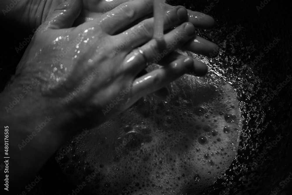 person washing hands in bathroom person washing hands in bathroom