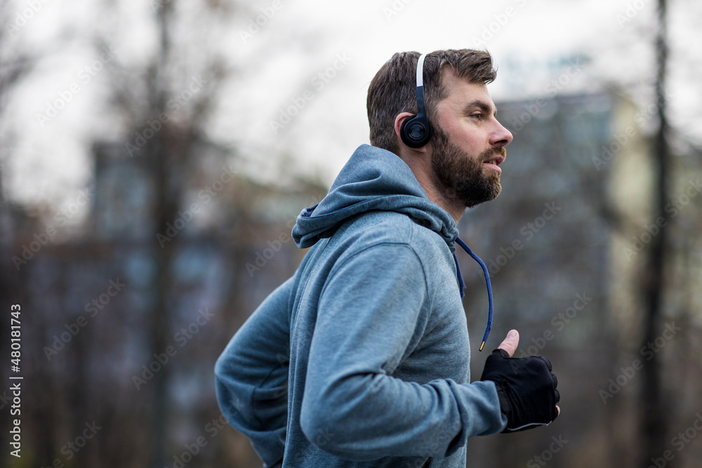 Young man running in the city
