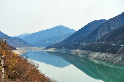 Zhinvali reservoir in the mountains of Georgia. Azure water on a background of mountains