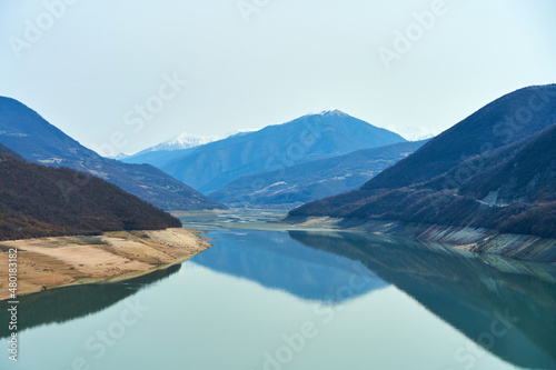 Zhinvali reservoir in the mountains of Georgia. Azure water on a background of mountains