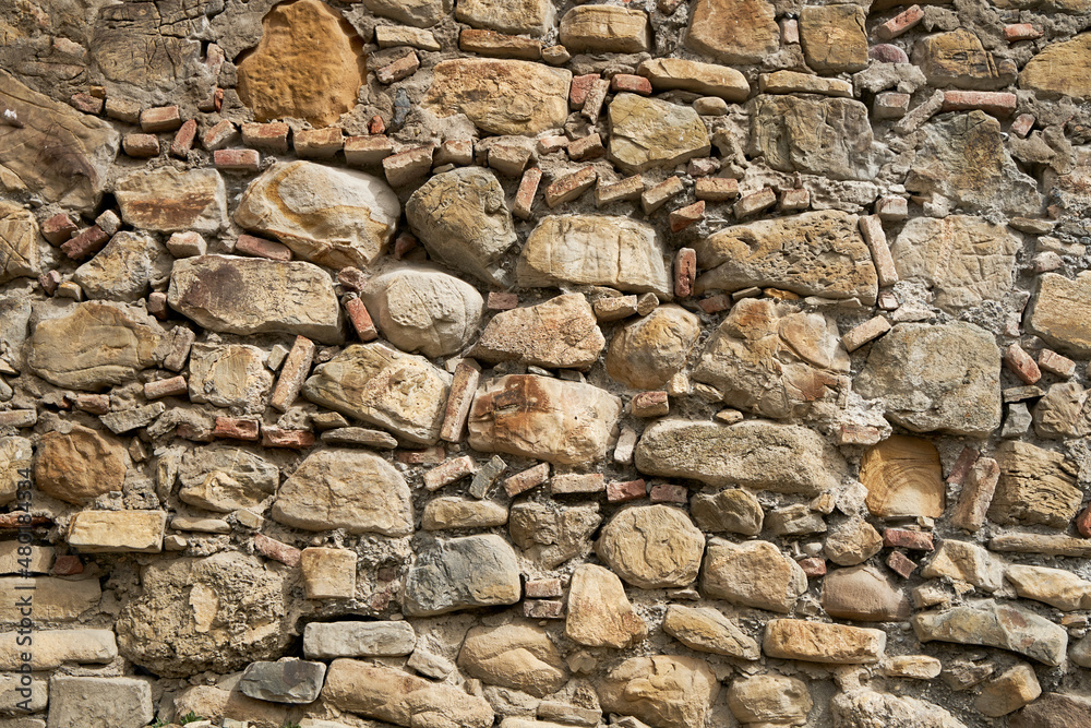 Rock stone texture. A wall built of mountain stones Rock stone texture. A wall built of mountain stones