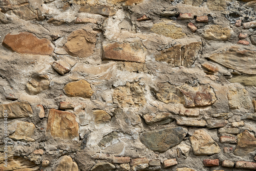 Rock stone texture. A wall built of mountain stones Rock stone texture. A wall built of mountain stones