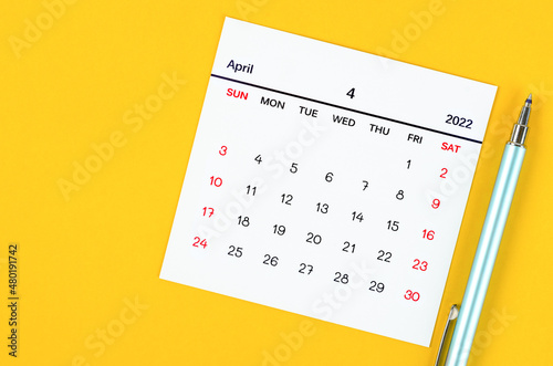 April 2022 calendar on yellow background.