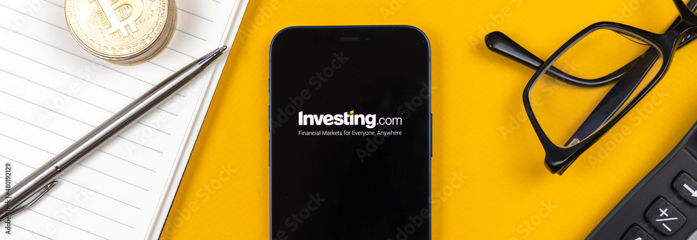 Investing.com application logo, banner design. Business desktop background,  top view photo Stock Photo | Adobe Stock